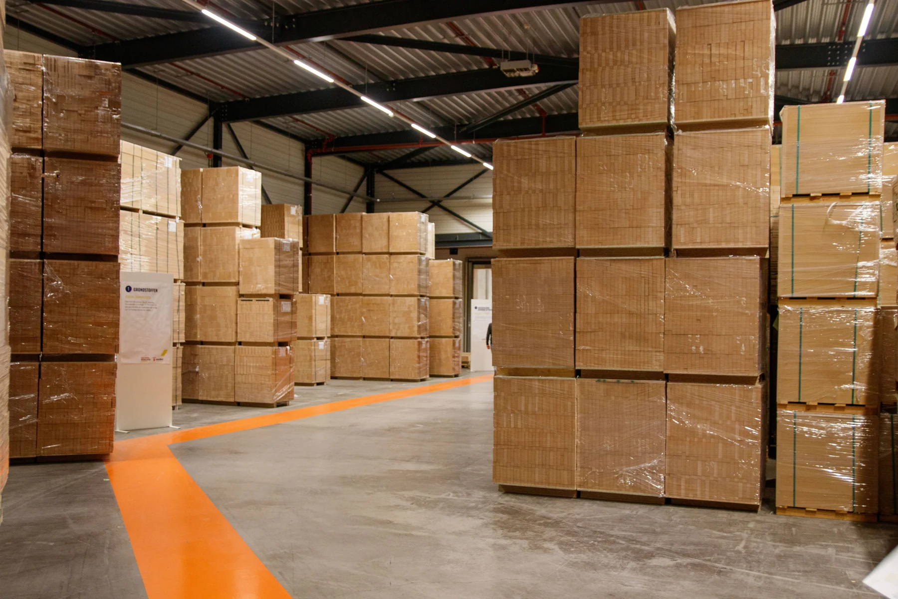 Palletized cartons arranged in a warehouse for logistics handling